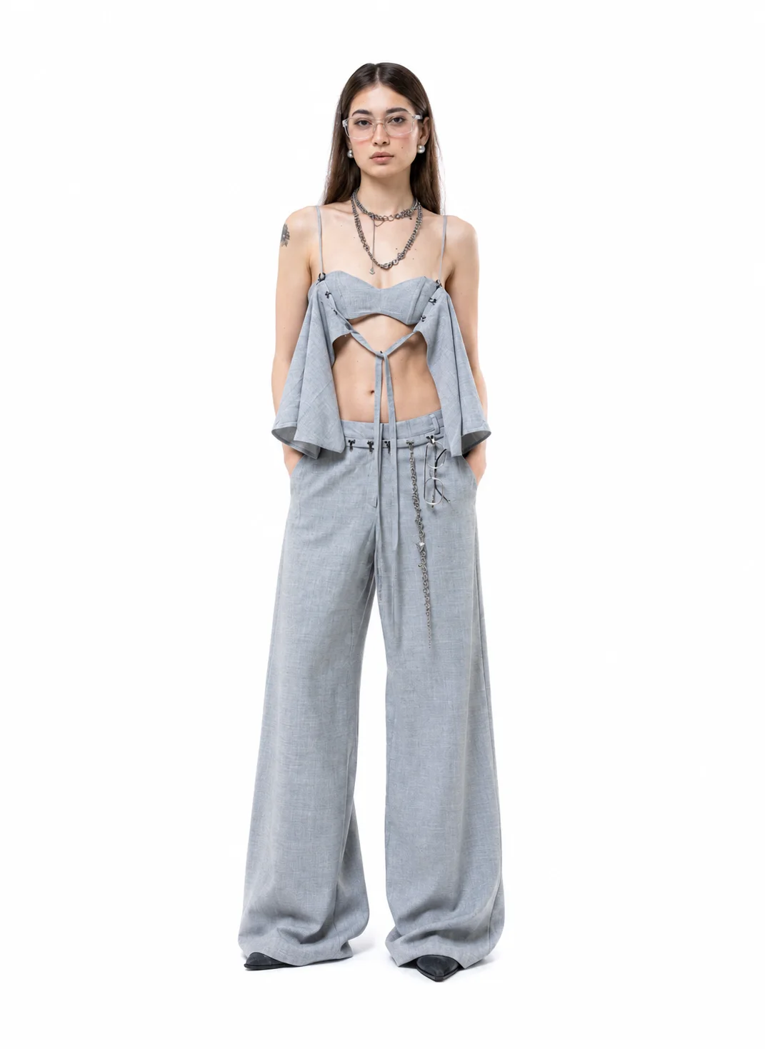 Model wearing the Borrowed Set with wide grey trousers
